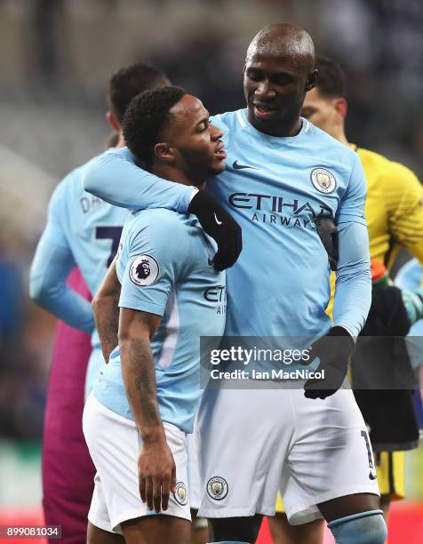 Raheem Sterling of Manchester City celebrates victory with Eliaquim Mangala of Manchester City after the Premier League match between Newcastle...