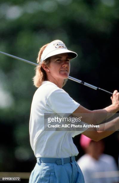 Beth Daniel golfing.