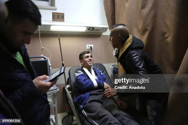 Symbol of the Jerusalem resistance, Fevzi el Cuneydi , who was taken into custody by a number of Israeli soldiers, talks to his relatives as he sits...