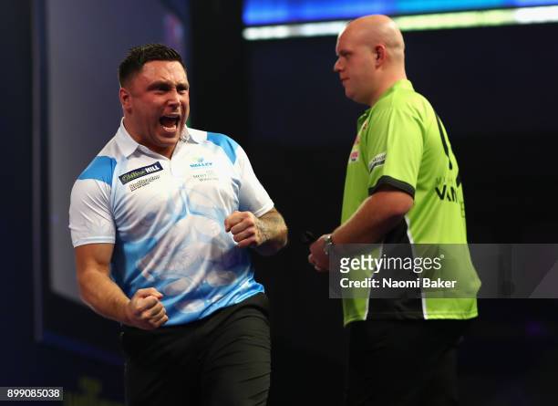 Gerwyn Price of Wales celebrates winning a leg during his third round match against Michael van Gerwen of the Netherlands on day eleven of the 2018...