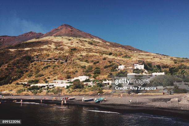 view of stromboli island from the port - stromboli stock-fotos und bilder