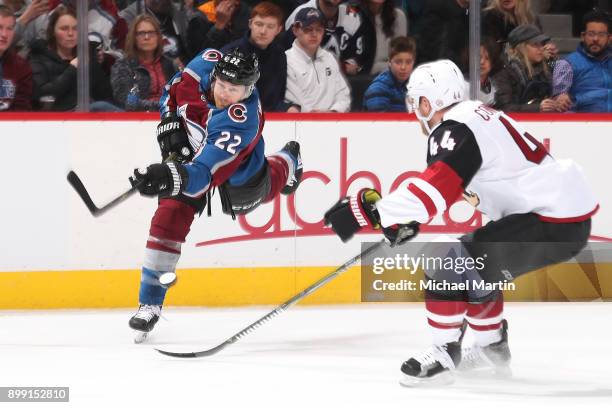 Kevin Connauton of the Arizona Coyotes deflects a shot by Colin Wilson of the Colorado Avalanche at the Pepsi Center on December 27, 2017 in Denver,...