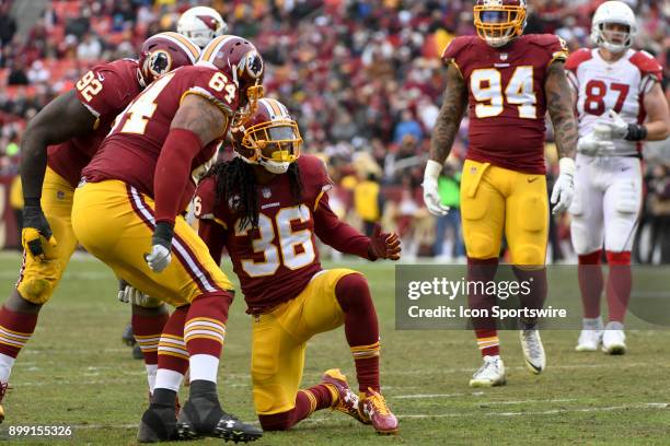 Washington Redskins free safety D.J. Swearinger is congratulated by defensive tackle A.J. Francis and defensive end Stacy McGee after a sack against...