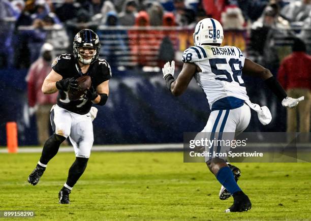Baltimore Ravens running back Danny Woodhead in action against Indianapolis Colts linebacker Tarell Basham on December 23 at M&T Bank Stadium in...