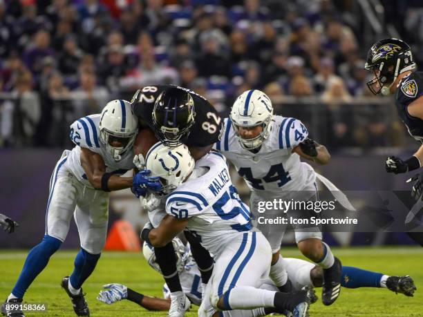 Baltimore Ravens tight end Benjamin Watson in action against Indianapolis Colts inside linebacker Antonio Morrison , defensive back Kenny Moore and...