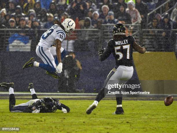 Indianapolis Colts wide receiver T.Y. Hilton cannot catch a pass in a heavy rain against Baltimore Ravens free safety Eric Weddle and inside...