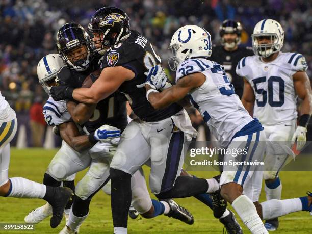 Baltimore Ravens running back Javorius Allen runs next to tight end Nick Boyle against the Indianapolis Colts on December 23 at M&T Bank Stadium in...