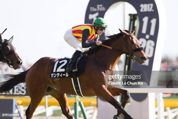 Jockey Mirco Demuro riding Sentir wins the Race 8 Oriental Sho during the Japan Cup race day at Tokyo Racecourse on November 26, 2017.