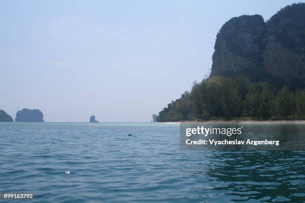 vertical limestone cliffs of koh poda island, thailand - koh poda stock pictures, royalty-free photos & images