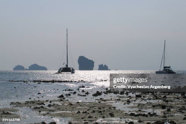 a beach at low tide, ko poda island, thailand - koh poda stock pictures, royalty-free photos & images