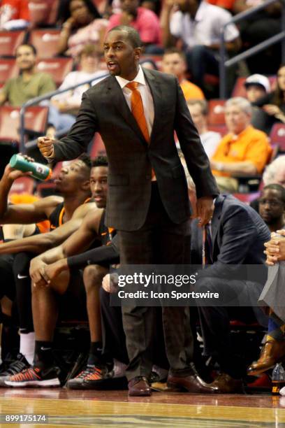 Oklahoma State Cowboys head coach Mike Boynton gives instruction to his team during the first half against the Florida State Seminoles in the...