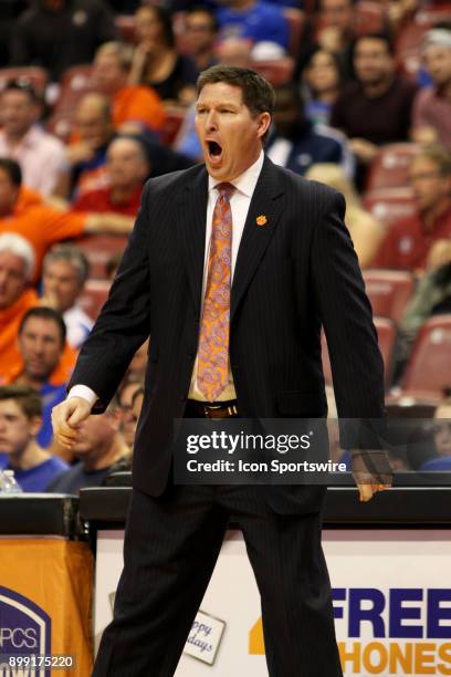 Clemson Tigers head coach Brad Brownell reacts to a foul call during the first half of the MetroPCS Orange Bowl Basketball Classic on December 16,...