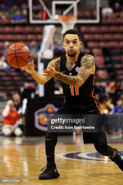 Florida Gators guard Chris Chiozza passes the ball during the first half against the Clemson Tigers in the MetroPCS Orange Bowl Basketball Classic on...