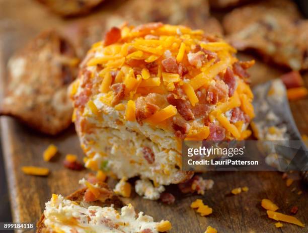bacon and cheddar cheese ball with crackers - cheese ball stock pictures, royalty-free photos & images