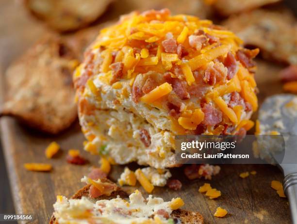 bacon and cheddar cheese ball with crackers - cheese ball stock pictures, royalty-free photos & images