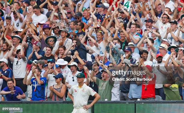 The Barmy Army celebrate in the crowd as Jackson Bird of Australia looks on during day three of the Fourth Test Match in the 2017/18 Ashes series...