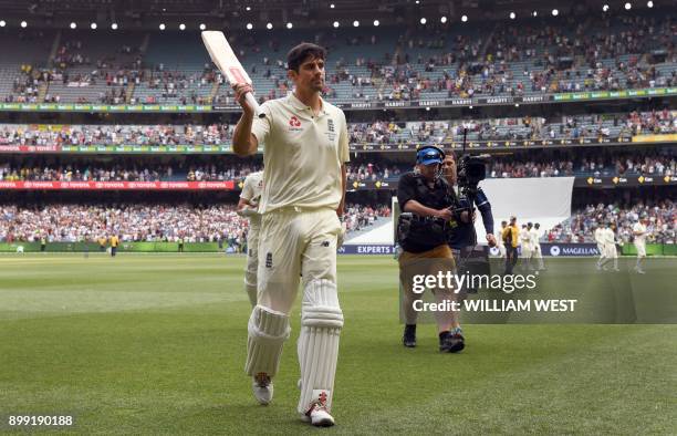 England batsman Alastair Cook acknowledges the applause after scoring 244 not out against Australia on the third day of the fourth Ashes cricket Test...