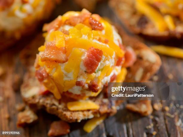 bite size bacon and cheddar cheese ball with crackers - cheese ball stock pictures, royalty-free photos & images