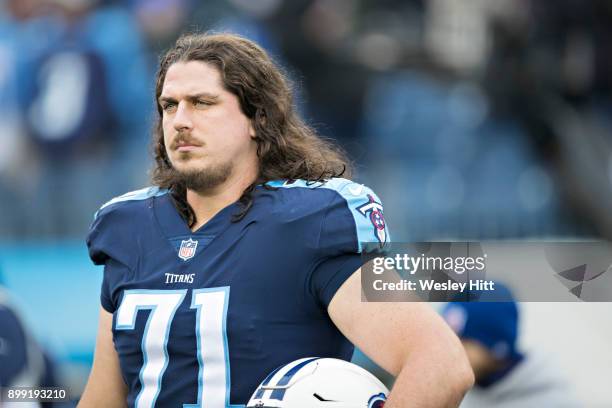 Dennis Kelly of the Tennessee Titans on the field before a game against the Los Angeles Rams at Nissan Stadium on December 24, 2017 in Nashville,...