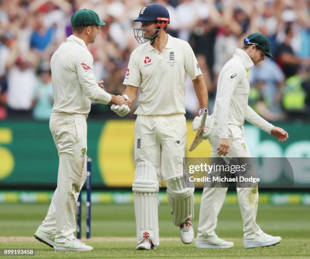 Australian captain Steve Smith walks off as Alastair Cook of England shakes hands with Shaun Marsh of Australia at the close of play after making 244...