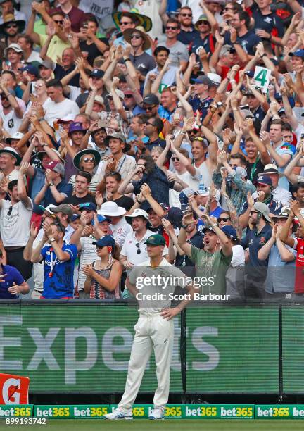 The Barmy Army celebrate in the crowd as Jackson Bird of Australia looks on during day three of the Fourth Test Match in the 2017/18 Ashes series...