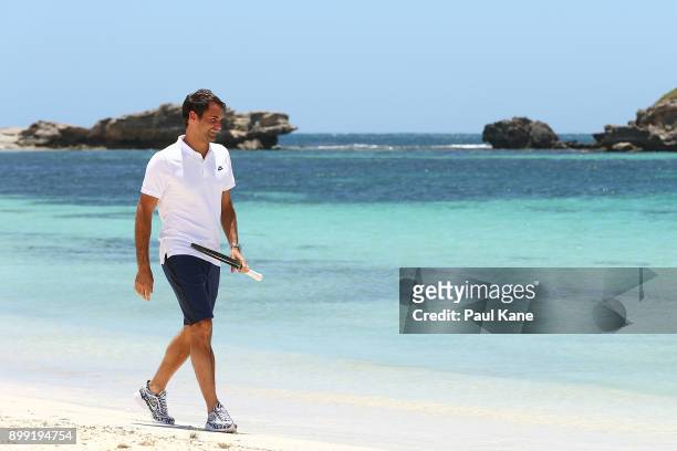 Roger Federer of Switzerland walks along the beach after arriving at Rottnest Island ahead of the 2018 Hopman Cup on December 28, 2017 in Perth,...