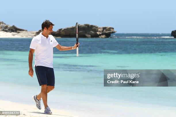 Roger Federer of Switzerland walks along the beach after arriving at Rottnest Island ahead of the 2018 Hopman Cup on December 28, 2017 in Perth,...