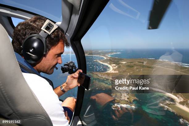 Roger Federer of Switzerland takes a photo from a helicopter on-route to Rottnest Island ahead of the 2018 Hopman Cup on December 28, 2017 in Perth,...