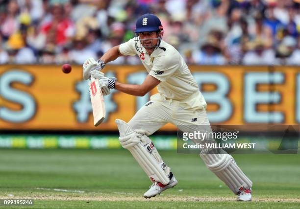 England batsman Alastair Cook drives a delivery from the Australian bowling on the third day of the fourth Ashes cricket Test match at the MCG in...