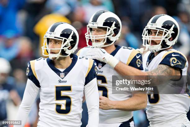 Sam Ficken is consoled by Johnny Hekker and Tyler Higbee of the Los Angeles Rams after missing a field goal during a game against the Tennessee...