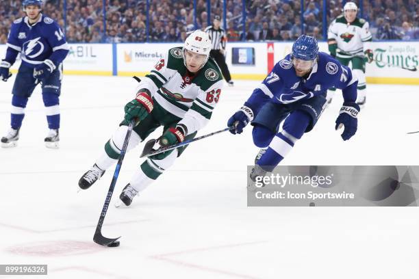 Minnesota Wild left wing Tyler Ennis is defended by Tampa Bay Lightning defenseman Victor Hedman in the first period of the NHL game between the...