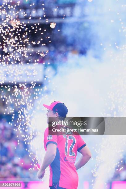 Stephen O'Keefe of the Sixers runs onto the field during the Big Bash League match between the Sydney Sixers and the Adelaide Strikers at Sydney...