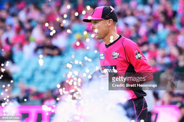 Johan Botha of the Sixers runs onto the field during the Big Bash League match between the Sydney Sixers and the Adelaide Strikers at Sydney Cricket...