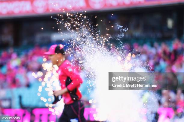 Johan Botha of the Sixers runs onto the field during the Big Bash League match between the Sydney Sixers and the Adelaide Strikers at Sydney Cricket...