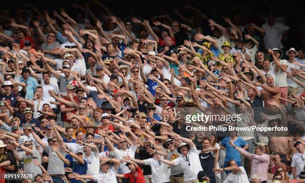 England fans sing during the third day of the fourth Ashes cricket test match between Australia and England at the Melbourne Cricket Ground on...