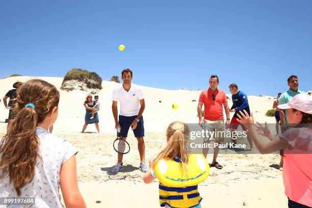 Roger Federer of Switzerland plays some tennis on the beach with children at Rottnest Island ahead of the 2018 Hopman Cup on December 28, 2017 in...