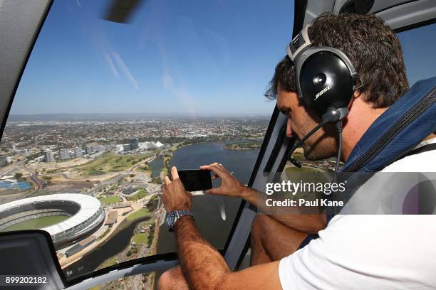 Roger Federer of Switzerland takes a photo from a helicopter on-route back from Rottnest Island ahead of the 2018 Hopman Cup on December 28, 2017 in...