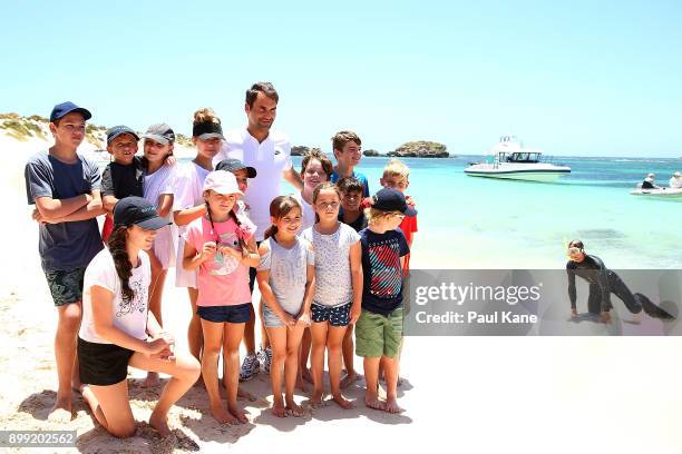 Roger Federer of Switzerland poses for photos on the beach at Rottnest Island ahead of the 2018 Hopman Cup on December 28, 2017 in Perth, Australia.