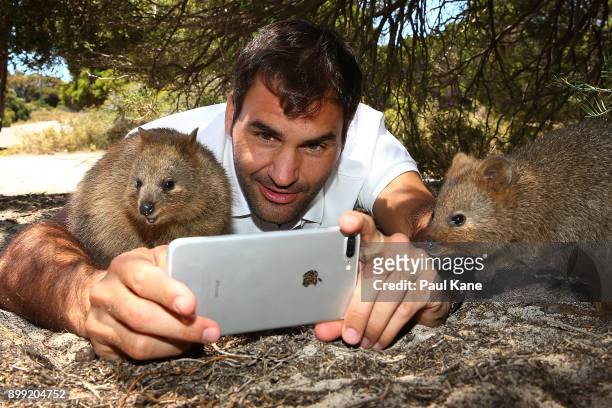 Roger Federer of Switzerland takes a selfie with a Quokka at Rottnest Island ahead of the 2018 Hopman Cup on December 28, 2017 in Perth, Australia.