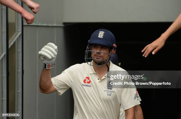 Alastair Cook comes back on to the field during the third day of the fourth Ashes cricket test match between Australia and England at the Melbourne...