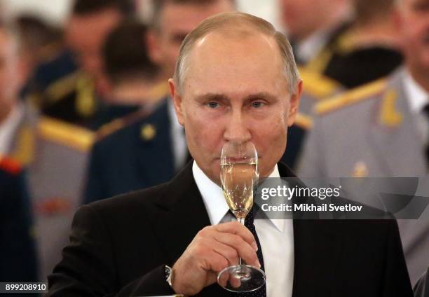 Russian President Vladimir Putin attends a reception for military servicemen who took part in Syrian campaign, at Grand Kremlin Palace on December...