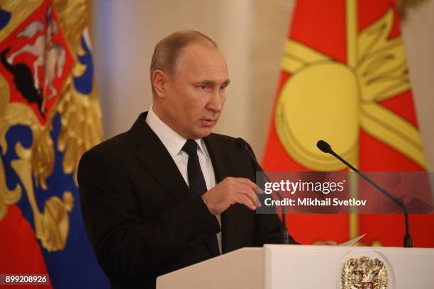 Russian President Vladimir Putin speaks during a reception for military servicemen who took part in Syrian campaign, at Grand Kremlin Palace on...