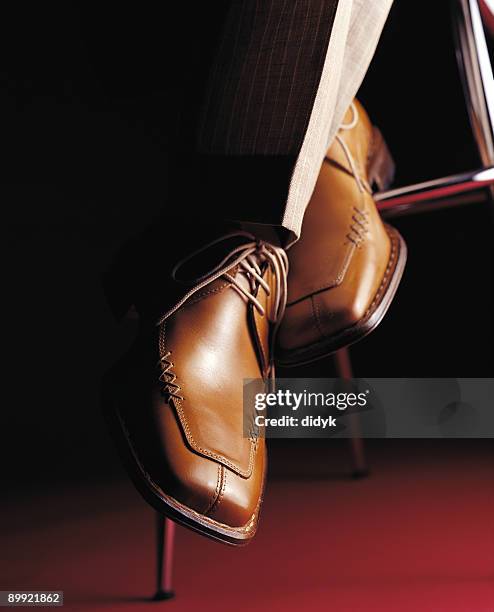 close-up of classy pair of brown leather men's shoes - bruine schoen stockfoto's en -beelden