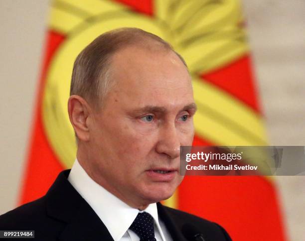 Russian President Vladimir Putin attends a reception for military servicemen who took part in Syrian campaign, at Grand Kremlin Palace on December...