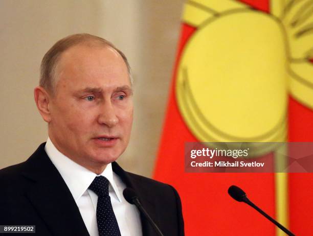 Russian President Vladimir Putin speaks during a reception for military servicemen who took part in Syrian campaign, at Grand Kremlin Palace on...