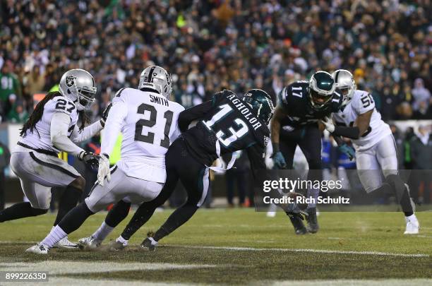 Nelson Agholor of the Philadelphia Eagles attempts to catch a deflected ball in the end zone off the hands of Alshon Jeffery as Sean Smith of the...