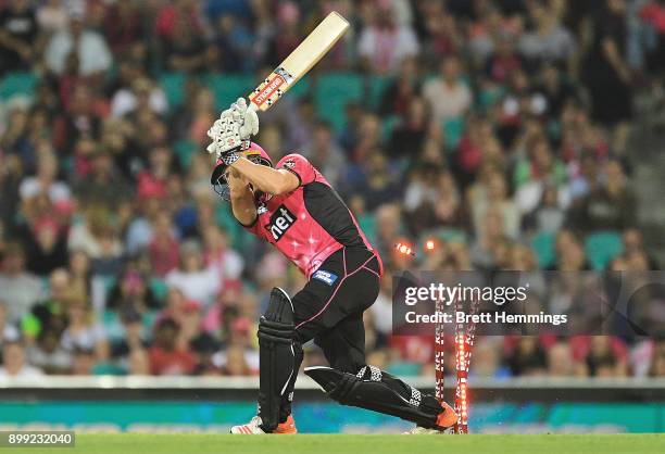 Stephen O'Keefe of the Sixers is bowled out by Michael Neser of the Strikers during the Big Bash League match between the Sydney Sixers and the...
