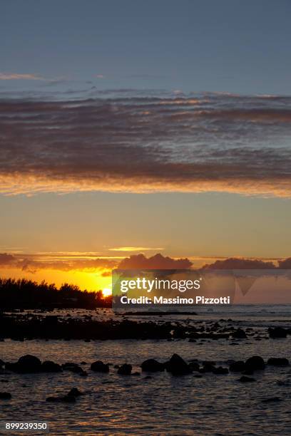sunset at grand bay, mauritius - massimo pizzotti ストックフォトと画像