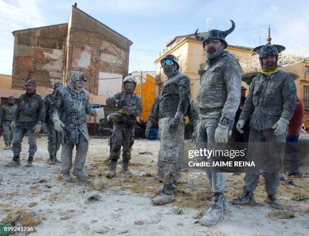 Revellers dressed in mock military garb take part in the "Els Enfarinats" battle in the southeastern Spanish town of Ibi on December 28, 2017. During...