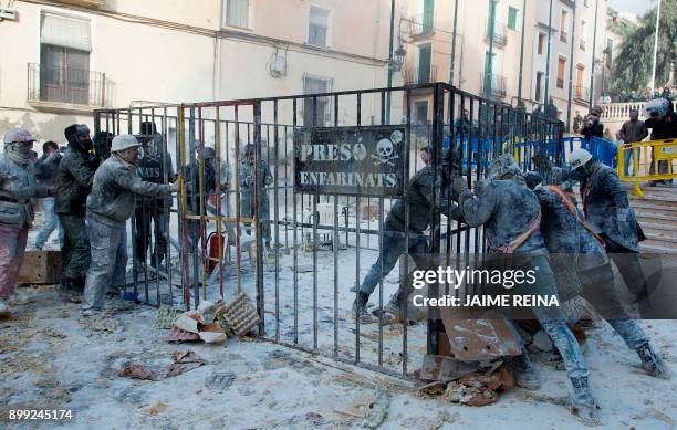 Revellers dressed in mock military garb take part in the "Els Enfarinats" battle in the southeastern Spanish town of Ibi on December 28, 2017. During...